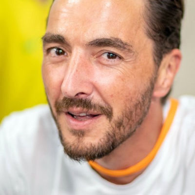AT